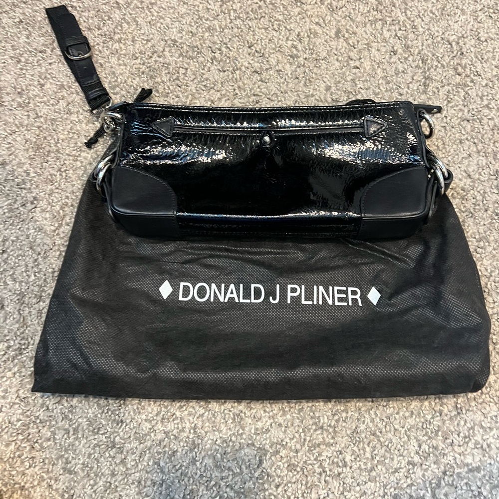Donald J Pliner black patent leather clutch/wristlet